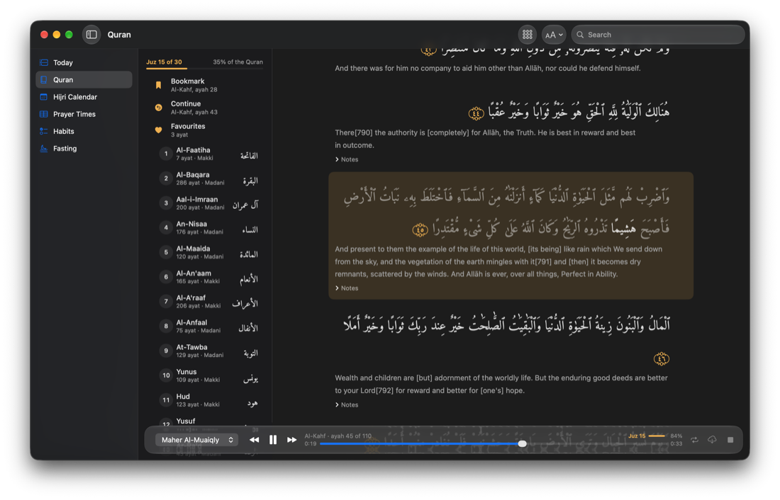 Al-Kahf mid-recitation, ayah 45 lit in gold with the word being recited at full strength, and the player floating in glass over the bottom of the reader: Maher Al-Muaiqly, ayah 45 of 110, and a gold Juz 15 meter at 84%